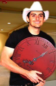 Brad Paisley holding his red antique personalized wall clock